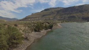 A view of a river and rolling hills